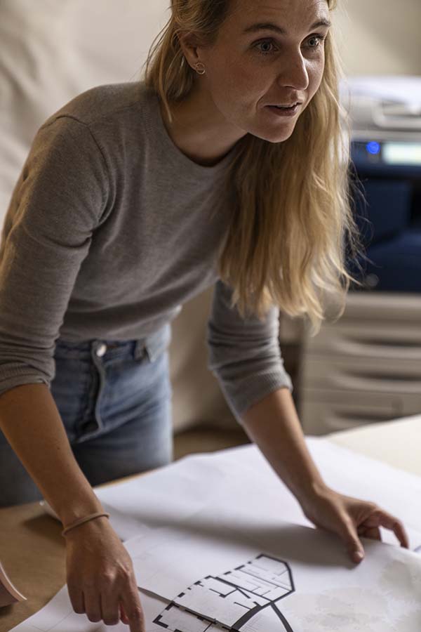 Woman with floorplan